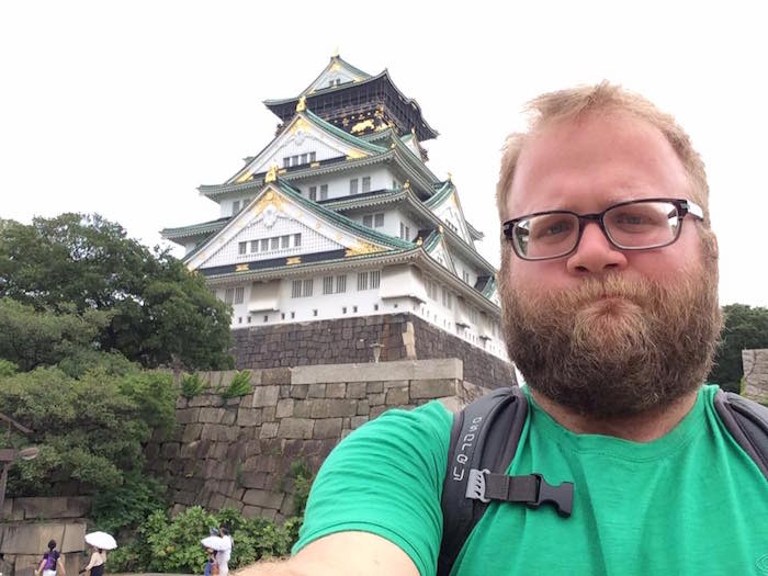 at Osaka Castle (大阪城), frustrated at taking a selfie with an iPad after my phone died in June of 2015