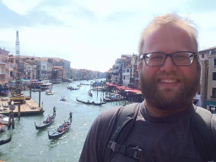 standing on the Ponte di Rialto overlooking the Grand Canal in Venice in May of 2015